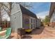 Outdoor shed with novelty signage and unique decorative touches, adjacent to a patio area at 1313 Garden Cir, Longmont, CO 80501