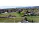Neighborhood with grassy fields and walking path among mature trees in the spring at 4845 S Taft St, Morrison, CO 80465