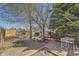 Large backyard features mature trees, a deck, a shed, and a picnic table for entertaining outdoors at 4845 S Taft St, Morrison, CO 80465