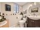 Charming powder room with decorative mirror and fixtures at 4845 S Taft St, Morrison, CO 80465
