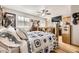 Bright bedroom featuring wood floors, and a bed with decorative pillows at 4845 S Taft St, Morrison, CO 80465