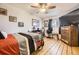 Cozy bedroom with hardwood floors and a ceiling fan at 4845 S Taft St, Morrison, CO 80465