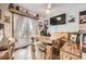 Charming dining area with a unique wooden table, bench seating and French doors at 4845 S Taft St, Morrison, CO 80465
