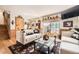Cozy living room with stylish decor, hardwood floors, and a staircase at 4845 S Taft St, Morrison, CO 80465