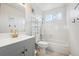 This full bathroom offers a tub and shower combo, vanity, and updated lighting at 3660 S Ouray Cir, Aurora, CO 80013