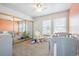 Bright Bedroom with a large closet, a rocking chair, and neutral walls at 3660 S Ouray Cir, Aurora, CO 80013