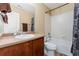 A bathroom featuring a shower with curtain and a vanity, providing a convenient space at 464 N Jamestown Way, Aurora, CO 80018