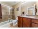 A bathroom featuring glass shower doors and a vanity with storage, perfect for relaxation at 464 N Jamestown Way, Aurora, CO 80018