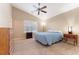 A primary bedroom featuring a fan, closet, and a large window, creating a relaxing retreat at 464 N Jamestown Way, Aurora, CO 80018