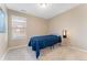 A bedroom with a window, plush carpet and neutral walls, making it a cozy and inviting space at 464 N Jamestown Way, Aurora, CO 80018