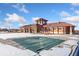Community pool covered for the winter season with clubhouse in the background at 464 N Jamestown Way, Aurora, CO 80018