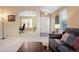 Spacious living room with neutral carpet, lots of light, and comfortable seating at 464 N Jamestown Way, Aurora, CO 80018