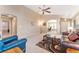 Comfortable living room with neutral carpet, ceiling fan and natural light at 464 N Jamestown Way, Aurora, CO 80018