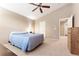 A primary bedroom featuring a fan, closet, and a neutral palette for a comfortable retreat at 464 N Jamestown Way, Aurora, CO 80018