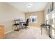 Well-lit office space featuring a large window and functional furniture arrangement at 464 N Jamestown Way, Aurora, CO 80018
