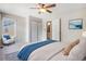 Bedroom with lots of natural light, neutral decor, and hardwood floors at 1566 S Syracuse St, Denver, CO 80231