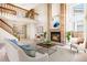 Bright living room boasts soaring ceilings, fireplace, and open floor plan at 1566 S Syracuse St, Denver, CO 80231