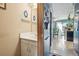 Convenient half bathroom adjacent to the dining area, featuring a white vanity at 2991 W 81St Ave # G, Westminster, CO 80031