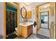 This is a bathroom with a skull-themed shower curtain and light purple walls at 2991 W 81St Ave # G, Westminster, CO 80031
