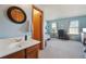 Attached bathroom with a wood vanity and a view of the bedroom at 2991 W 81St Ave # G, Westminster, CO 80031