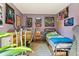 Bedroom featuring carpet, exercise equipment, light purple walls, and wood trim at 2991 W 81St Ave # G, Westminster, CO 80031