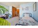 A bedroom with a bed, wood closet, and light blue walls at 2991 W 81St Ave # G, Westminster, CO 80031