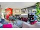 Cozy living room featuring a stone fireplace, plush seating, and colorful decor at 2991 W 81St Ave # G, Westminster, CO 80031