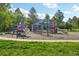 Vibrant and fun playground area with various play structures and mature trees at 2991 W 81St Ave # G, Westminster, CO 80031