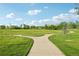 Scenic view of a well-maintained walking path through a lush green space at 2991 W 81St Ave # G, Westminster, CO 80031