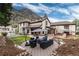 Backyard featuring a stone patio with comfortable outdoor seating, ideal for entertaining at 200 Rose St, Georgetown, CO 80444