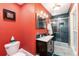 A modern bathroom featuring a dark wood vanity and large glass shower enclosure at 200 Rose St, Georgetown, CO 80444