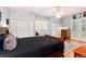 Comfortable primary bedroom featuring hardwood floors, storage, and natural light at 200 Rose St, Georgetown, CO 80444