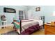 A bedroom includes an electric fireplace, dark wood furniture, and soft yellow walls at 200 Rose St, Georgetown, CO 80444