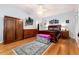 Comfortable primary bedroom boasts ample closet space, hardwood floors, and a large bed at 200 Rose St, Georgetown, CO 80444
