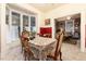 Bright dining room featuring vintage furniture, bay windows, and inviting atmosphere at 200 Rose St, Georgetown, CO 80444