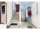 Hallway with staircase, convenient storage and access to other areas of the home at 200 Rose St, Georgetown, CO 80444