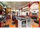 The chef's kitchen seamlessly adjoins the living spaces with cherry cabinetry, granite counters, and hardwood floors at 200 Rose St, Georgetown, CO 80444