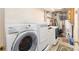 Functional laundry area with washer, dryer, water heater, and utility connections at 200 Rose St, Georgetown, CO 80444