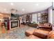 Inviting living room with fireplace, hardwood floors, leather furniture, and modern decor at 200 Rose St, Georgetown, CO 80444