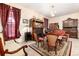 Cozy living room featuring floral wallpaper, vintage furniture and a fireplace at 200 Rose St, Georgetown, CO 80444