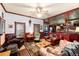 The living room adjoins the kitchen and features a ceiling fan, original woodwork, and a cozy sitting area at 200 Rose St, Georgetown, CO 80444