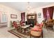 Vintage living room with fireplace, floral wallpaper, and a charming ambiance at 200 Rose St, Georgetown, CO 80444