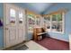 Inviting mudroom with natural light, bench seating, and exterior views, perfect for entry at 200 Rose St, Georgetown, CO 80444