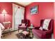The sitting area includes two maroon armchairs, a small table, and decor at 200 Rose St, Georgetown, CO 80444