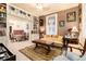 Inviting sitting room with plaid wallpaper, built-in shelves, and classic decor at 200 Rose St, Georgetown, CO 80444