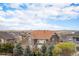 Residential area with diverse home styles and open space, under a blue sky at 42363 Glen Abbey Dr, Elizabeth, CO 80107