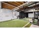 Lower level with artificial turf, practice cage and room for golf equipment at 42363 Glen Abbey Dr, Elizabeth, CO 80107