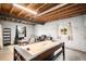 Entertaining basement featuring an air hockey table and a comfortable lounge area, perfect for recreation at 42363 Glen Abbey Dr, Elizabeth, CO 80107