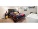 Cozy bedroom featuring carpet floors, natural light, and modern decor at 42363 Glen Abbey Dr, Elizabeth, CO 80107