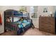 bedroom with bunk beds, window view, carpet and dresser at 42363 Glen Abbey Dr, Elizabeth, CO 80107